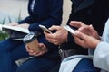 Group hands, phone and coffee in communication, social media or networking for chatting or texting. Hand of people Royalty Free Stock Photo