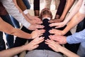 Group Of Hands Touching Man`s Body Lying On Table