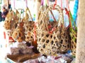 Group of hanging bamboo baskets for quail eggs. Royalty Free Stock Photo