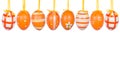 Group of hanging Easter eggs on a white background