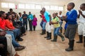 Group of happy African American people dancing together in a room