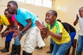 Group of happy African American people dancing together in a room