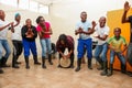 Group of happy African American people dancing together in a room