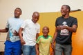 Group of happy African American people dancing together in a room