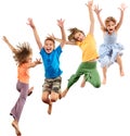 Group of happy barefeet cheerful sportive children jumping and dancing Royalty Free Stock Photo
