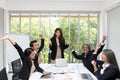 Group of happy business people cheering in office. Celebrate success. Business team celebrate a good job in the office. Asian Royalty Free Stock Photo