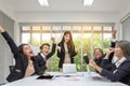 Group of happy business people cheering in office. Celebrate success. Business team celebrate a good job in the office. Asian Royalty Free Stock Photo