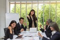 Group of happy business people cheering in office. Celebrate success. Business team celebrate a good job in the office. Asian Royalty Free Stock Photo