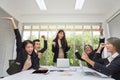 Group of happy business people cheering in office. Celebrate success. Business team celebrate a good job in the office. Asian Royalty Free Stock Photo