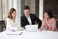 Group of happy business people men and woman working together on laptop in meeting room.teamwork of two girl asian and caucasian