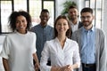 Group of happy businesspeople in modern light office Royalty Free Stock Photo