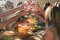 Group of happy and cheerful caucasian people women have fun all together drinking and toasting with red wine - friendship and