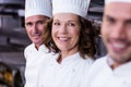 Group of happy chefs smiling at the camera