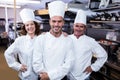 Group of happy chefs smiling at the camera