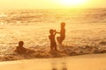 Group of Happy child playing in the sea.