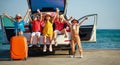 Group happy children girls and boys friends   on   car ride to summer trip Royalty Free Stock Photo