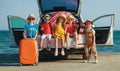 Group happy children girls and boys friends    on the car ride to summer trip Royalty Free Stock Photo