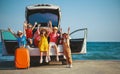 Group happy children girls and boys friends   on   car ride to summer trip Royalty Free Stock Photo