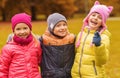 Group of happy children hugging in autumn park Royalty Free Stock Photo