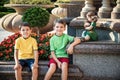 Group of happy children playing outdoors. Kids having fun in park during summer vacation. Friends walking in sunglasses and Royalty Free Stock Photo