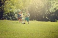 Group of happy children playing with soccer ball