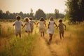 Group of happy children running in the field at sunset. Back view. A group of happy children full rear view running a grass field Royalty Free Stock Photo