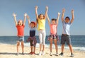 Group of happy children at sea beach on sunny day. Summer camp Royalty Free Stock Photo