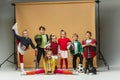 Group of happy children show different sport. Studio fashion concept. Emotions concept. Royalty Free Stock Photo