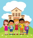 Group of happy children standing in front of the school building Royalty Free Stock Photo