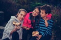 Group of happy children talking and eating pizza outdoors Royalty Free Stock Photo