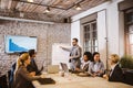 Happy colleagues talking while having business meeting in the office Royalty Free Stock Photo