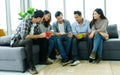 Group of happy creative team discussing while taking coffee break at office Royalty Free Stock Photo