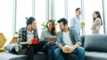 Group of happy creative team discussinng while taking coffee break at office Royalty Free Stock Photo