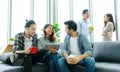 Group of happy creative team talking while taking coffee break at office Royalty Free Stock Photo