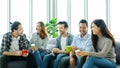 Group of happy creative team talking while taking coffee break at office Royalty Free Stock Photo