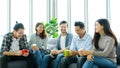 Group of happy creative team talking while taking coffee break at office Royalty Free Stock Photo