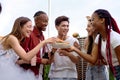 Group of happy diverse friends having fun at barbecue party outdoor in backyard Royalty Free Stock Photo