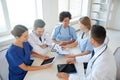 Group of happy doctors meeting at hospital office