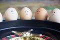 Group of happy eggs friends  make bets gambiling in the toy casino Royalty Free Stock Photo