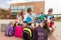 Group of happy elementary school students outdoors