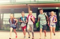 Group of happy elementary school students running