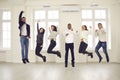 Group of happy energetic colleagues or friends jumping all together and celebrating success Royalty Free Stock Photo