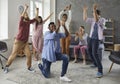 Group of happy friends applauding a funny black man while dancing at a party at home