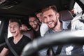 Group of happy friends on a car Royalty Free Stock Photo