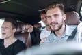 Group of happy friends on a car Royalty Free Stock Photo