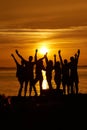 Group of happy friends hands up against the sunset Royalty Free Stock Photo