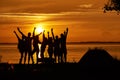 Group of happy friends hands up against the sunset Royalty Free Stock Photo