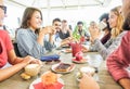 Group of happy friends having coffee break at bar cafeteria - Young students people enjoying breakfast - Friendship and good mood Royalty Free Stock Photo