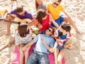 Group of happy friends having fun on beach Royalty Free Stock Photo