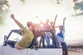 Group of happy friends having fun on convertible car in vacation - Young people drinking champagne and taking selfie Royalty Free Stock Photo